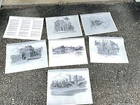 All six architectural prints with a text sheet displayed on pavement