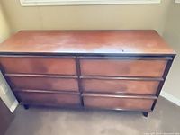 Front view of dresser showing six drawers and finish