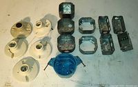 Group shot showing porcelain lampholders, steel junction boxes, extension rings, device boxes and blue plastic ceiling box