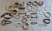 Group shot of all jewellery pieces laid out on white surface