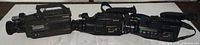 Three Sony camcorders laid side by side for overall view