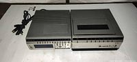 Two RCA SelectaVision Betamax VCRs side by side showing overall condition and attached cords