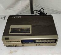 Front and top view of Sanyo Betamax VCR showing controls and tape compartment