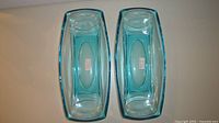 Top view of both Alpine turquoise glass dishes