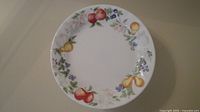 Single Corelle plate showing fruit motif border