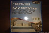 Front of HealthGuard Basic Protection mattress protector package showing branding and king size