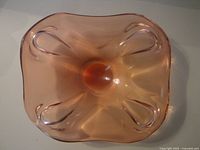 Top view showing square rose glass dish with swirl indentations