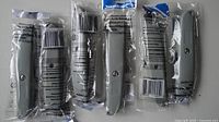 Five sealed Silverline grey retractable utility knives lined up