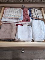 Drawer with assorted folded towels and washcloths