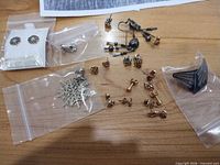 Overview of assorted earrings, backs, carded pair, snowflake, dangle set