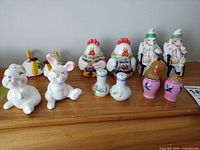 Group shot of all eight shaker pairs on mantel