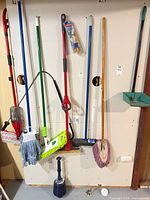 Overall view of cleaning tools hanging on wall