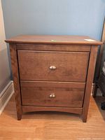 Front view of nightstand with drawers closed