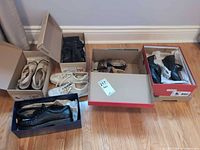 Overview of six pairs in boxes on floor