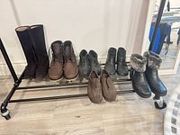 All six pairs on rack showing styles and condition