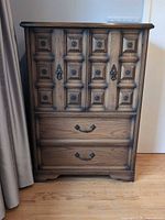 Front view of oak dresser showing cabinet doors and drawers