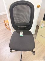 Front view showing mesh back and fabric seat