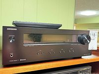 Front view of Onkyo TX-8220 with remote on top