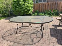 Full view of oval patio table on patio