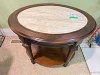 top view of oval table showing stone inlay and wood rim