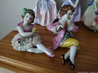 Both figurines on shelf