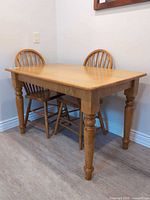 Full view of solid wood dining table against wall
