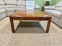Front view of square oak veneer coffee table