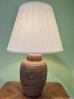 Front view of complete lamp illuminated on table