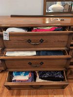 Dresser drawers with folded tops, jeans and socks