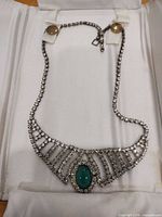 Rhinestone collar necklace displayed in case