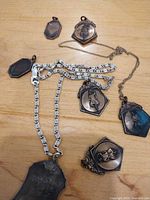 Group shot showing all pendants and chain on table