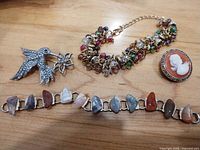 Group shot of all four jewelry pieces on table