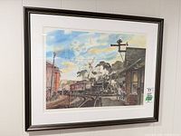 Full view of framed lithograph on wall
