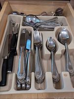 Drawer tray with full set of beaded pattern flatware, paring knives at left
