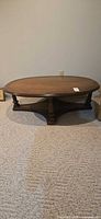 Full view of oval wood coffee table front
