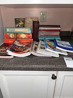 Group view of all cookbooks on countertop