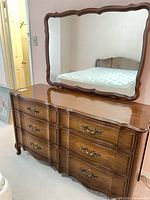 dresser with attached mirror front view