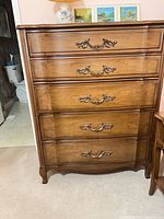 Front view of five-drawer highboy dresser showing full piece and hardware