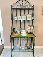 Front view of metal and wood baker's rack with shelves