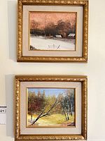 Front view of both framed paintings hung on wall