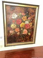 Full view of framed oil painting hung on wall