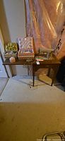 Overall lot showing sewing machine in cabinet with two sewing boxes and accessories