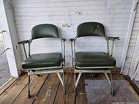 Front view of both Clarin folding chairs showing overall design and condition