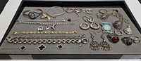 Overall view of all sterling jewelry pieces in lot