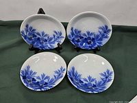 All four matching blue floral Koransha plates front view