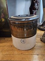 Crock with lid in place showing overall form and glaze