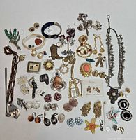 Full layout of entire costume jewelry lot showing all pieces