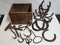 Overall lot with crate, horseshoes, forged tools