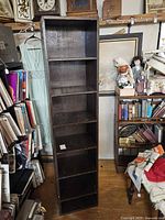 Front angled view showing five-shelf wood unit