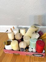Tray with assorted unused candles of various types and colors